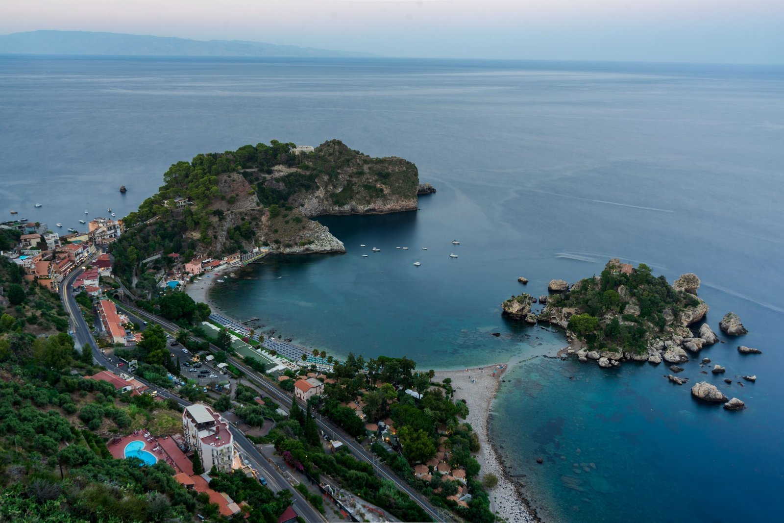 Aerial view of Isola Bella in Sicily with green landscape and blue water